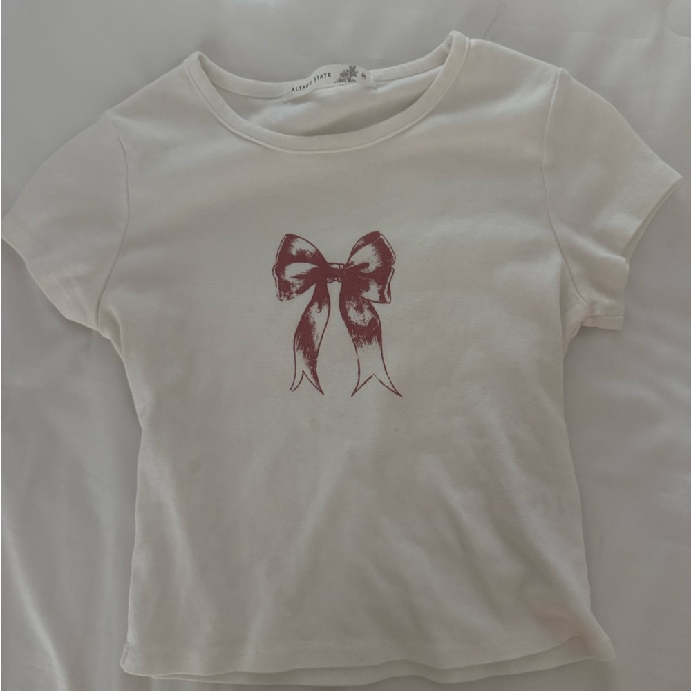 White Baby Tee with Pink Bow Design